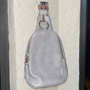 Chic Silver Leather Backpack with Patterned Strap